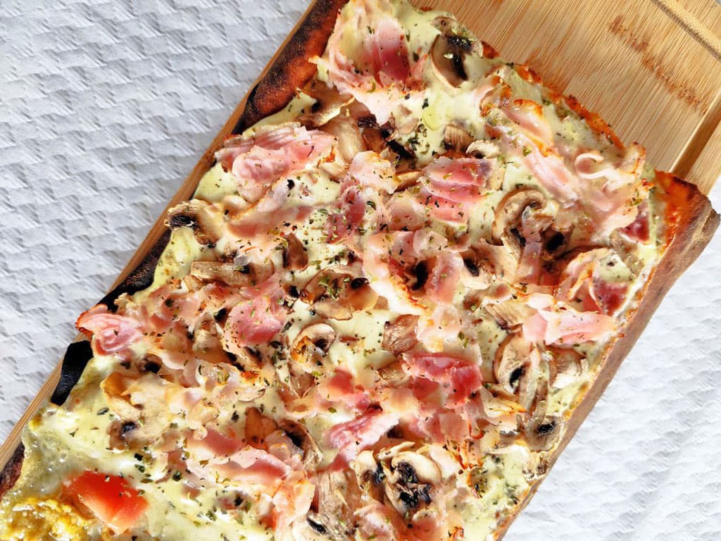 ¿Quiere disfrutar de su pizza a domicilio? ¡Nosotros se la llevamos!